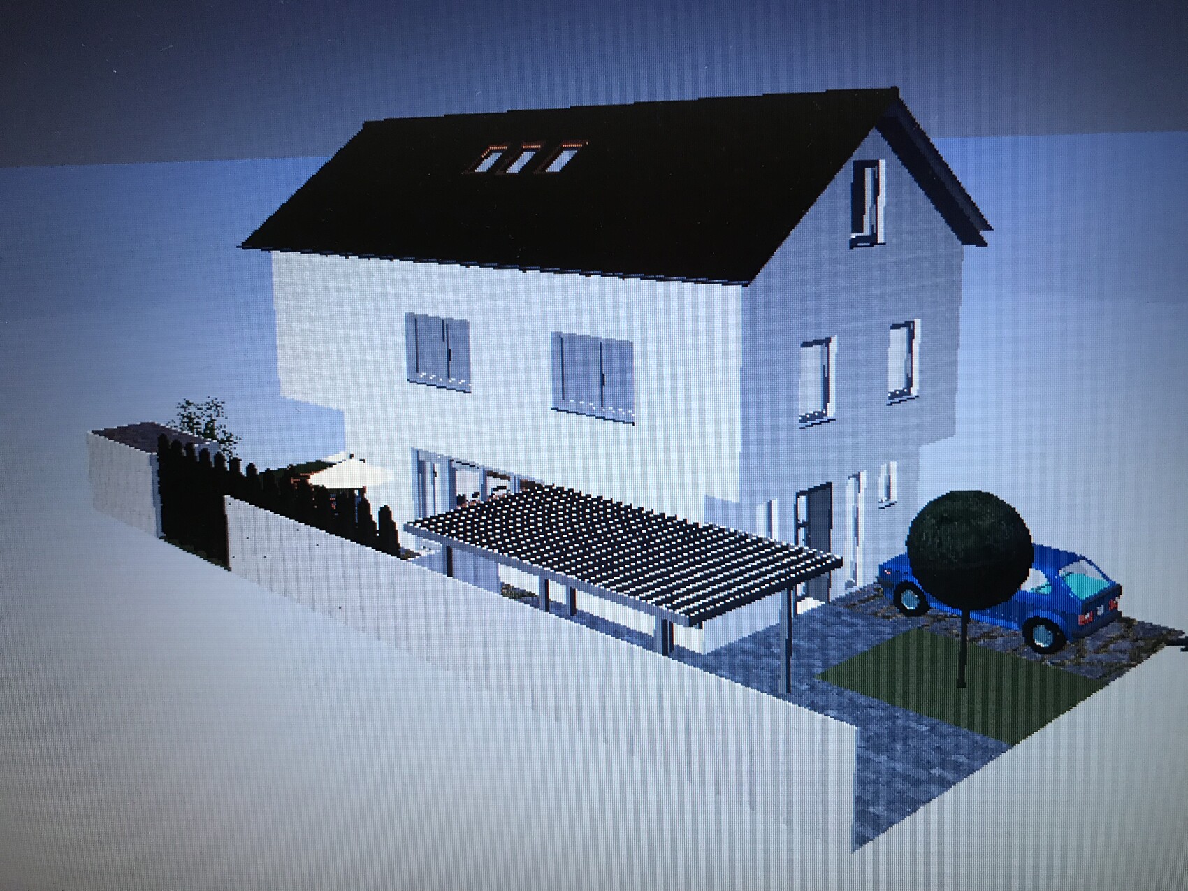 Zweistöckiges blaues Haus mit schwarzem Satteldach, Carport, blauer PKW, Garten und weißem Zaun.