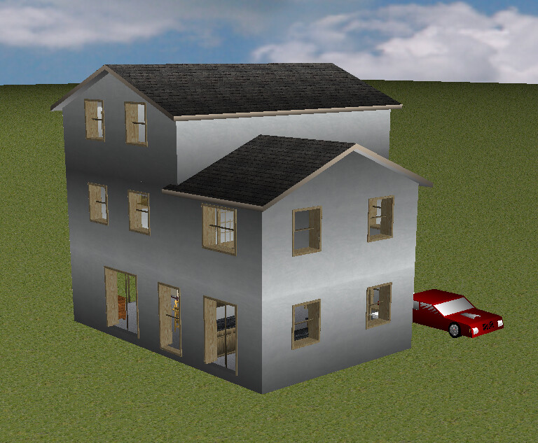 Mehrstöckiges graues Haus mit mehreren Fenstern und rotem Auto daneben auf Gras
