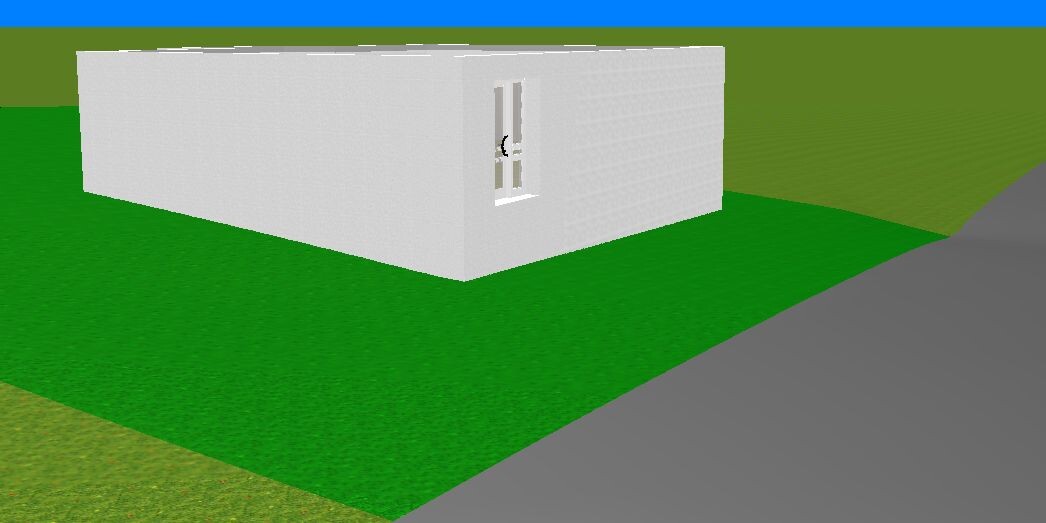 Dreidimensionales einfaches weißes Quaderhaus-Modell auf gruenem Gras neben einer Straße.