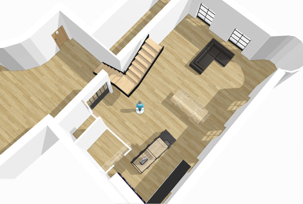 Obere Ansicht: Offener Wohnbereich mit Sofa, Esstisch, Kücheninsel, Treppe und Holzboden.