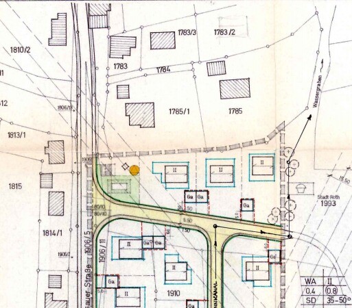 Lageplan einer Siedlung: Straßennetz, Parzellen, Gebäudegrundrisse.