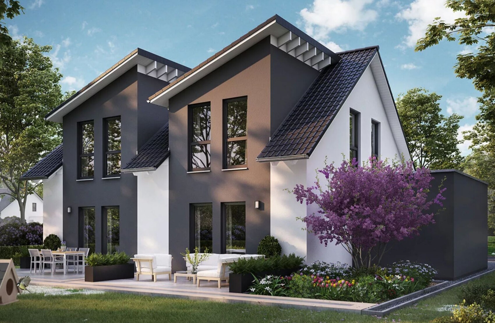 Modernes zweistöckiges Haus mit dunkler Fassade, großen Fenstern, Terrasse und lilafarbener Baum.