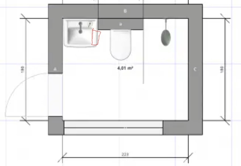 Grundriss eines Badezimmers: Tür links, Waschbecken links, Toilette Mitte, graue Wände.