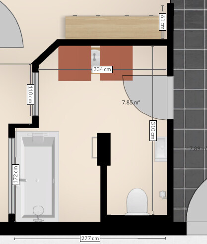 Grundriss eines Badezimmers mit Badewanne, Toilette, Waschbecken und Maßen