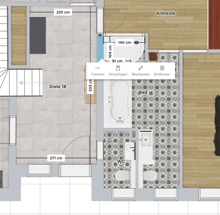 Grundriss eines Innenbereichs: Diele, Ankleide, Bad mit Badewanne, WC und Treppe.