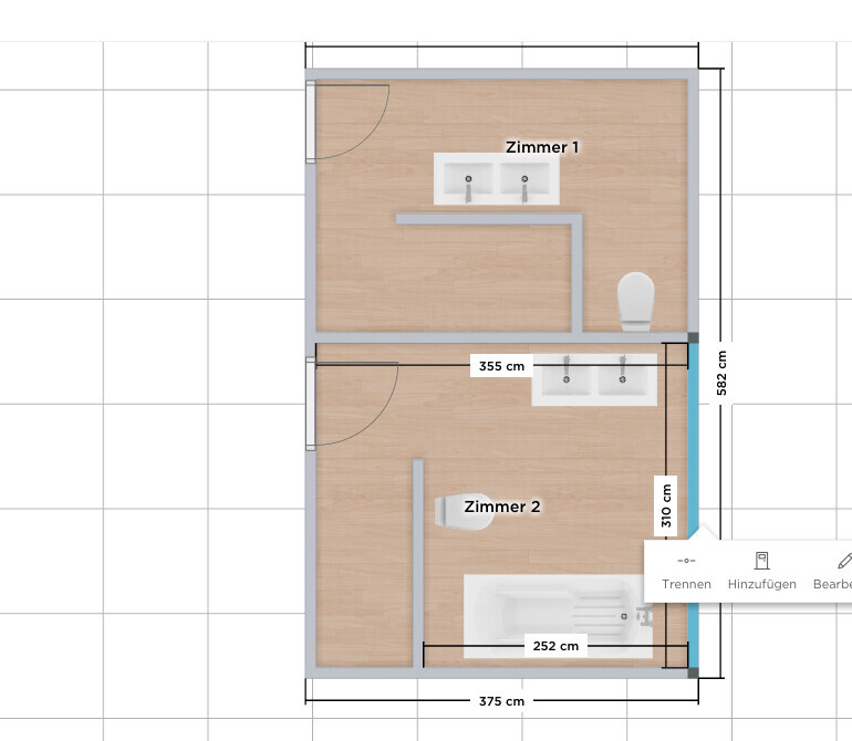 Grundriss eines Zweizimmerhauses mit zwei Waschbecken, Toilette und Badewanne.