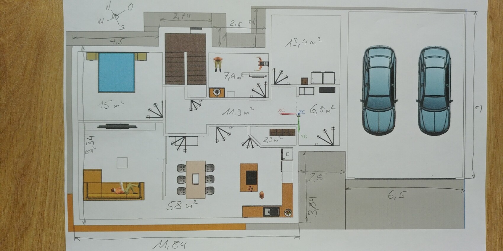 Grundriss eines Hauses: Räume, Küche, Essbereich, Wohnzimmer, Garage mit zwei Autos.
