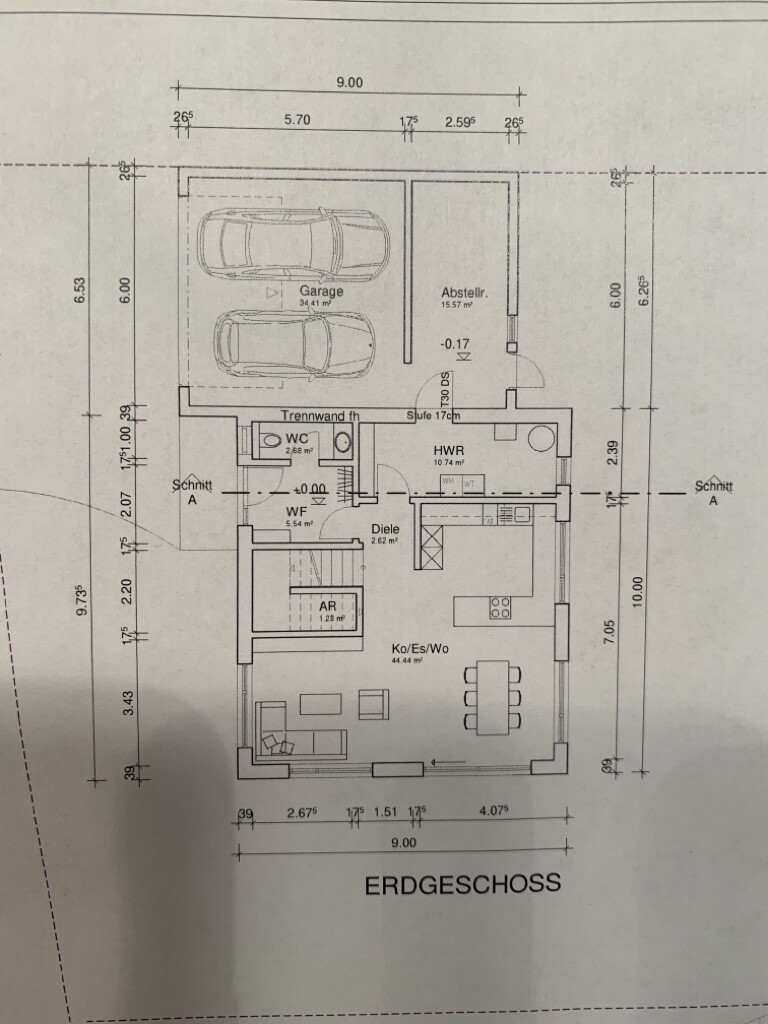 Grundriss Erdgeschoss: Garage mit zwei PKW, Ko/Es/Wo, Diele, HWR, AR, WC, Abstellraum.