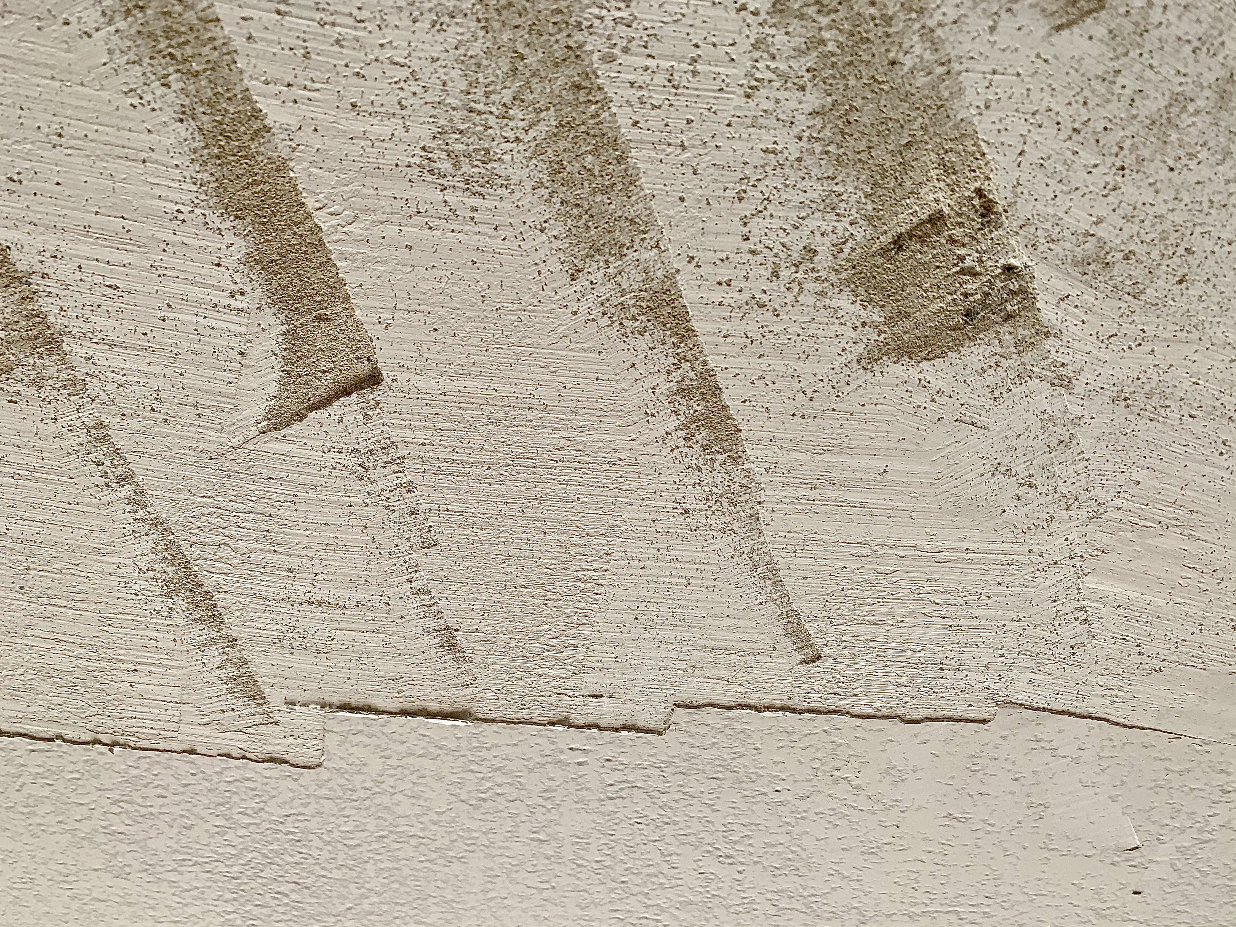 frischverputzte-wand-putzstruktur-sandige-oberfläche-mit-trowel-marken.jpeg
