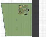 Top-Down-Siteplan: grosses Rasengrundstueck mit kleinem Gebaeudekomplex im oberen Bereich