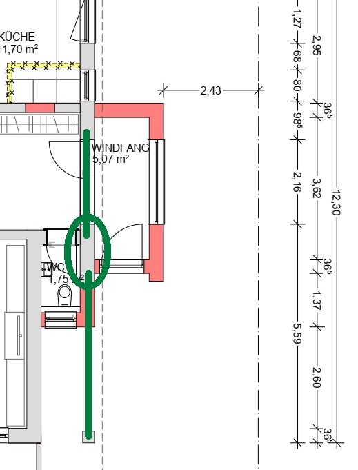 Grundriss eines Innenraums: Windfang (5,07 m²), Küche (1,70 m²) und WC; grüne Türachse markiert.