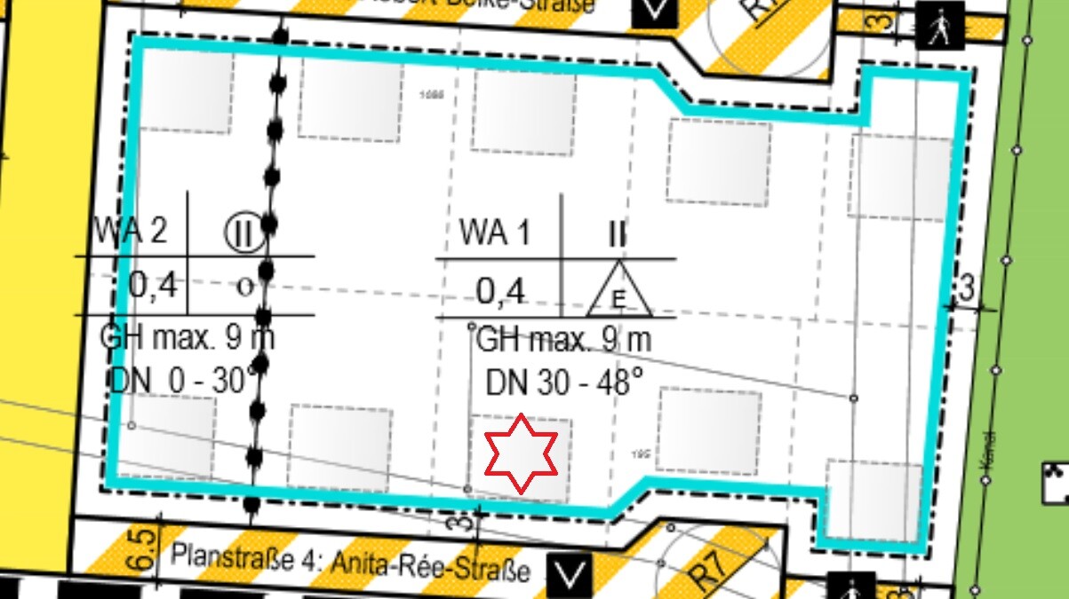 Lageplan eines Baugebiets mit blauer Umrandung, rotem Stern als Markierung.