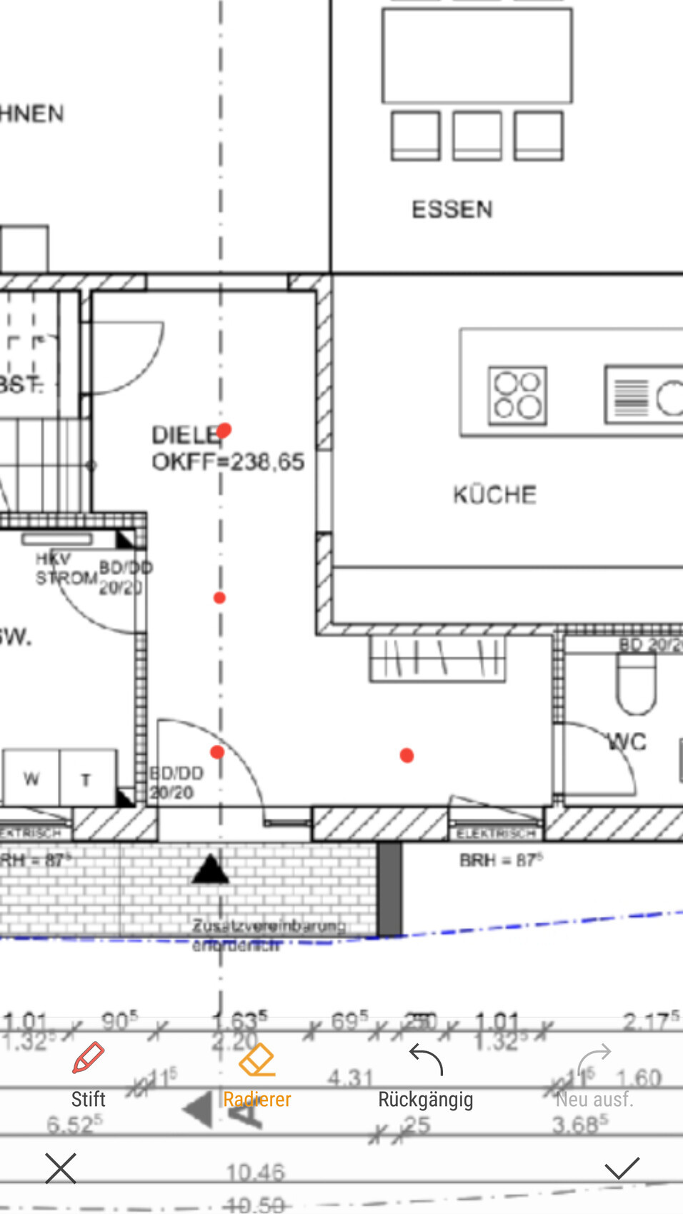 Grundriss eines Wohnhauses: Diele, Küche, Essbereich, WC, Treppenhaus, Eingangsbereich.