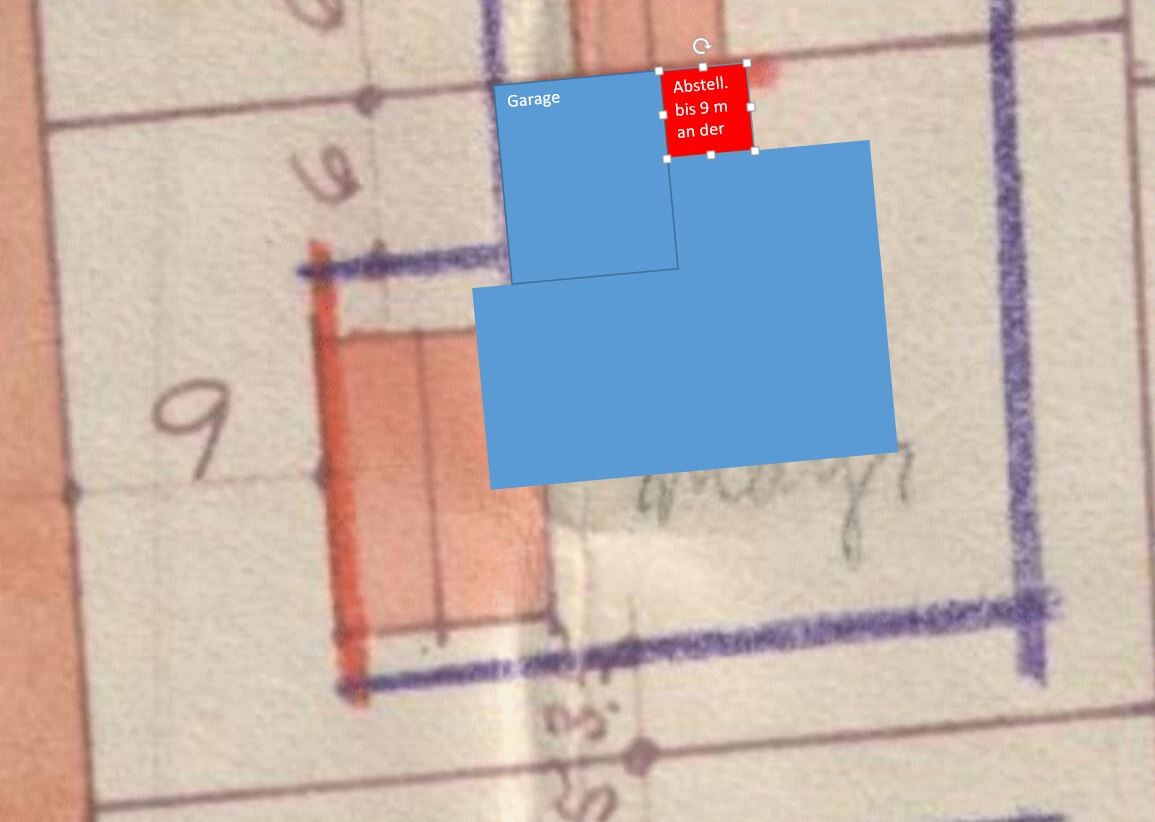 Grundriss mit blauer Gebäudefläche, rotem Abstellbereich und Beschriftung 'Garage'.