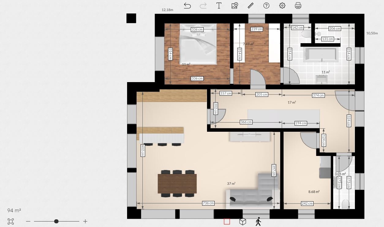 Grundriss einer Wohnung: offener Wohn-/Essbereich mit Kücheninsel, Schlafzimmer, Bad, Flur.