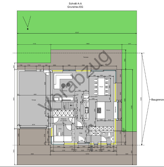 EG-Grundriss eines Hauses mit Garage, Terrasse, Garten und Baugrenze.
