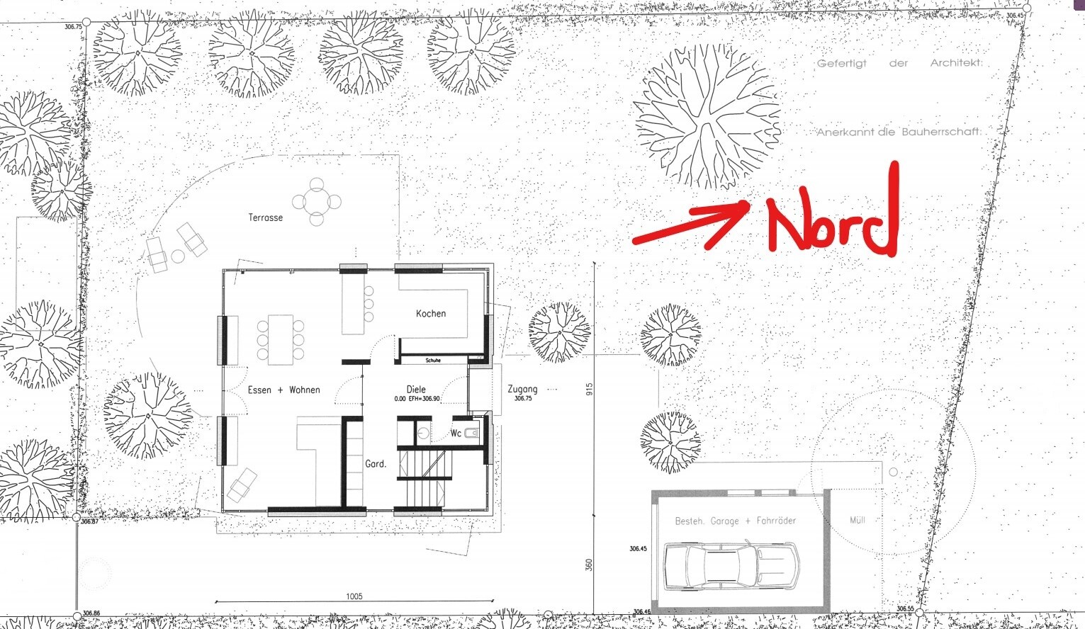 Grundriss eines Hauses mit Terrasse, Garten, Garage, Wohn- und Essbereich sowie Küche.