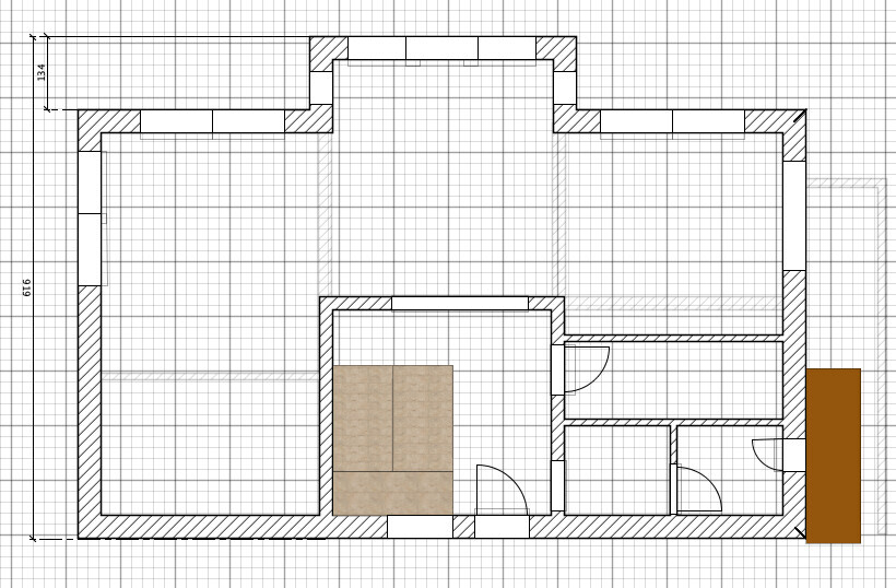 Grundriss eines Gebäudes mit mehreren Zimmern, Türen und Wänden; zentrale braune Fläche.