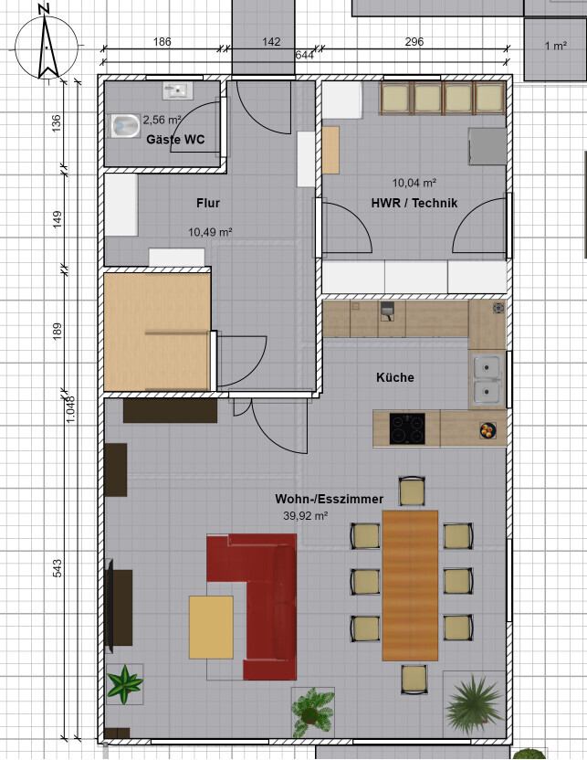 Grundriss einer Wohnung: Wohn-/Esszimmer, Küche, Flur, Gäste-WC, HWR/Technik.