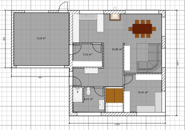 Grundriss eines Einfamilienhauses mit Wohn- und Essbereich, Küche, Bad