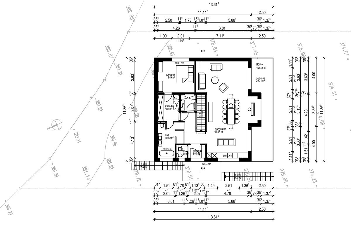 Grundriss eines Hauses mit Wohnküche, Schlafzimmer, Ankleide, Bad und Terrasse.