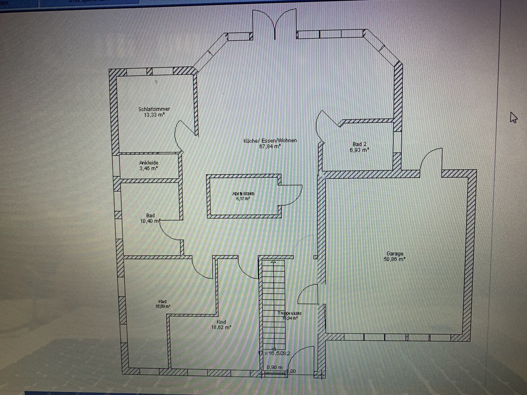 Grundriss eines Hauses mit Schlafzimmer, Küche/Wohnen, Bad, Ankleide, Garage.