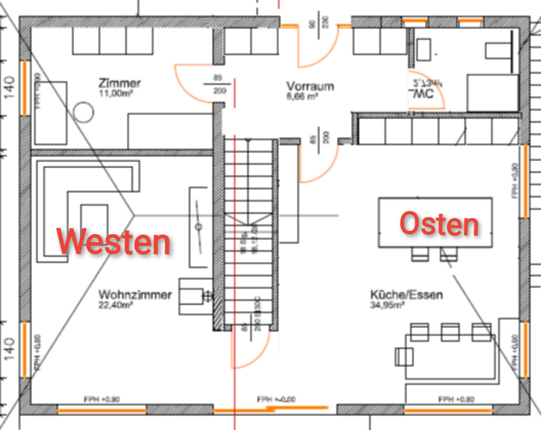 Grundriss eines Hauses: zentrale Treppe, links Wohnzimmer, rechts Küche/Essen, Vorraum oben.