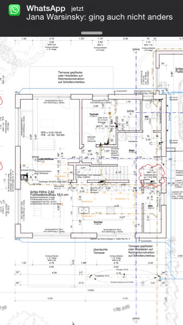 2D-Grundriss eines Hauses mit Küche, Wohnzimmer und Terrasse
