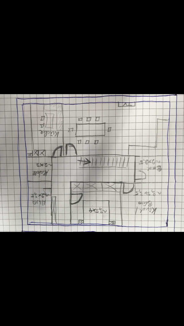 Handgezeichnete Grundrissskizze eines Hauses mit Innenwänden auf kariertem Papier