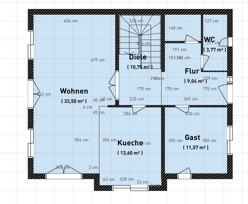 Grundriss eines Hauses mit Wohnen, Küche, Gast, Diele, Flur und WC inkl. Flächenangaben.