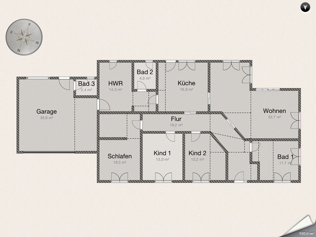 Grundriss eines Hauses: Garage, Flur, Küche, Wohnen, Bad 1–3, Schlafen, Kind 1–2, HWR.