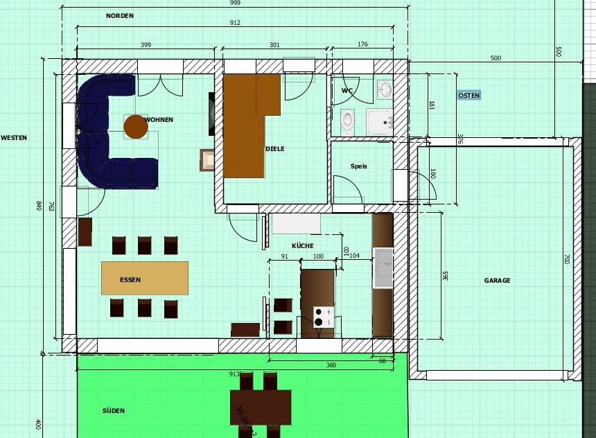 Grundriss Haus: Wohnzimmer, Essen, Küche, Diele, Bad, Speis, WC, Garage, Terrasse Süden.