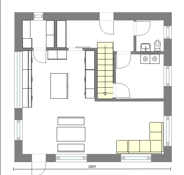 2D-Grundriss eines Hauses mit Wohnzimmer, Küche und Treppenhaus