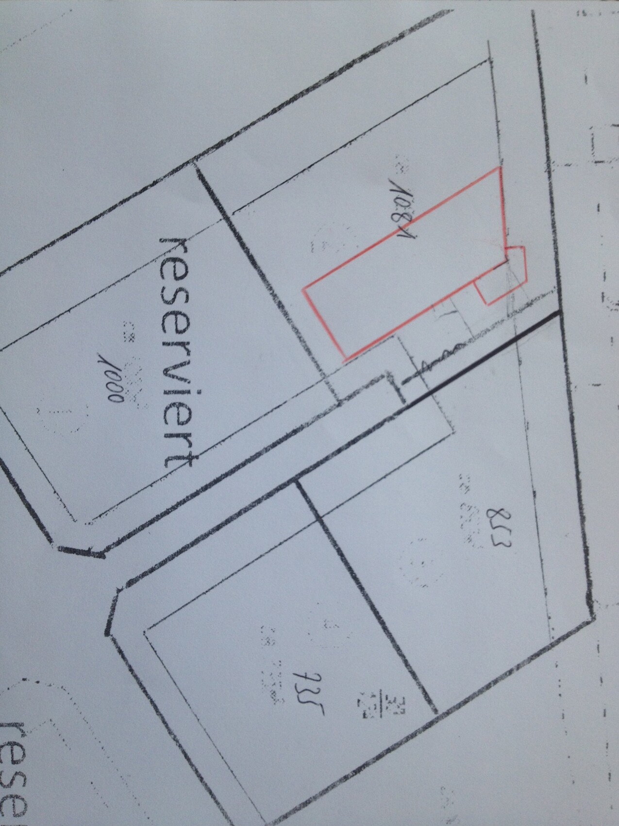 Architekturplan eines Grundrisses mit rotem Rechteck als Markierung.