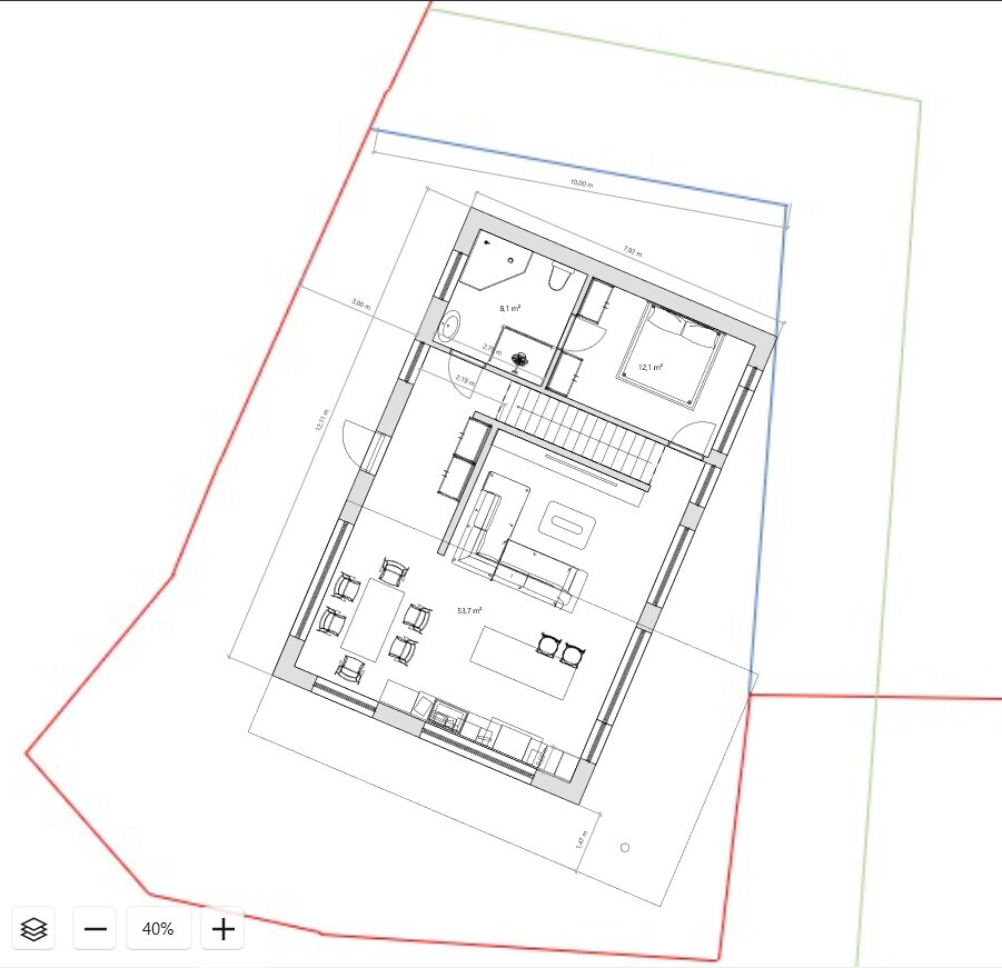 Grundriss eines Hauses: Wohnbereich, Küche, Essplatz, Treppe, Schlafzimmer, Bad.