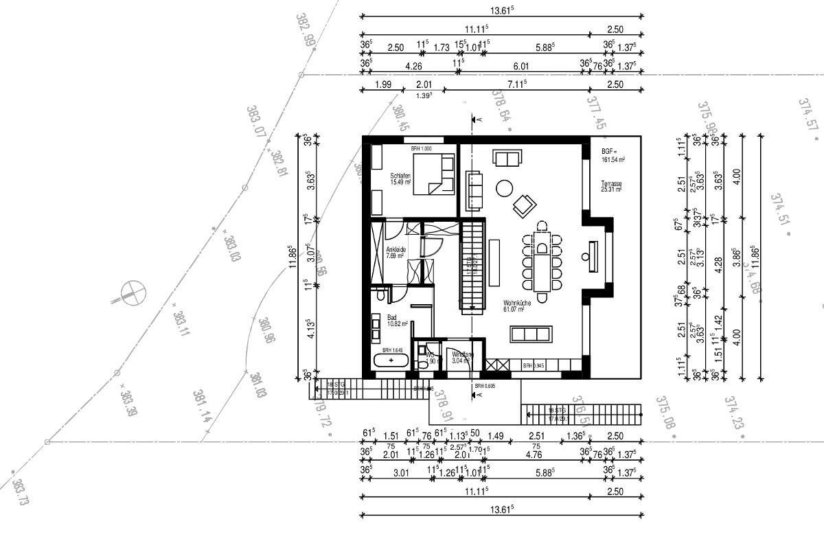 Grundriss eines Hauses mit Wohnküche, Schlafzimmer, Ankleide, Bad und Terrasse.