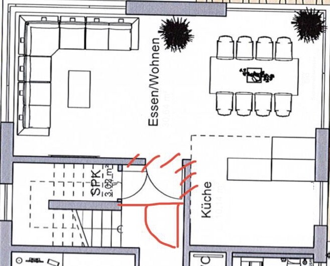 Grundriss eines Wohn-/Essbereichs mit links L-Sofa, rechts Esstisch und angrenzender Küche.
