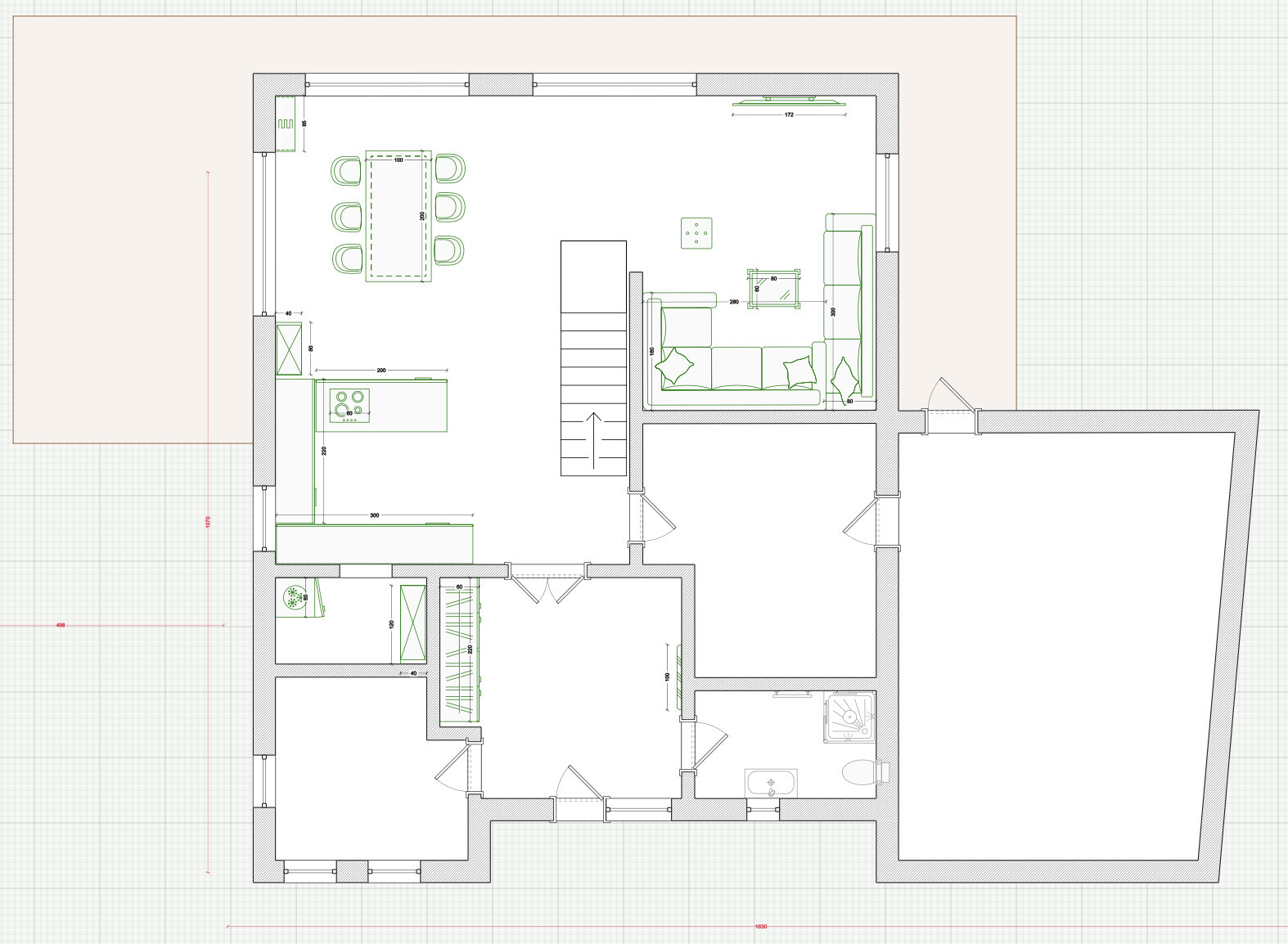 Grundriss eines Hauses: Küche und Essbereich links, Wohnzimmer rechts, Treppe Mitte, Bad unten.