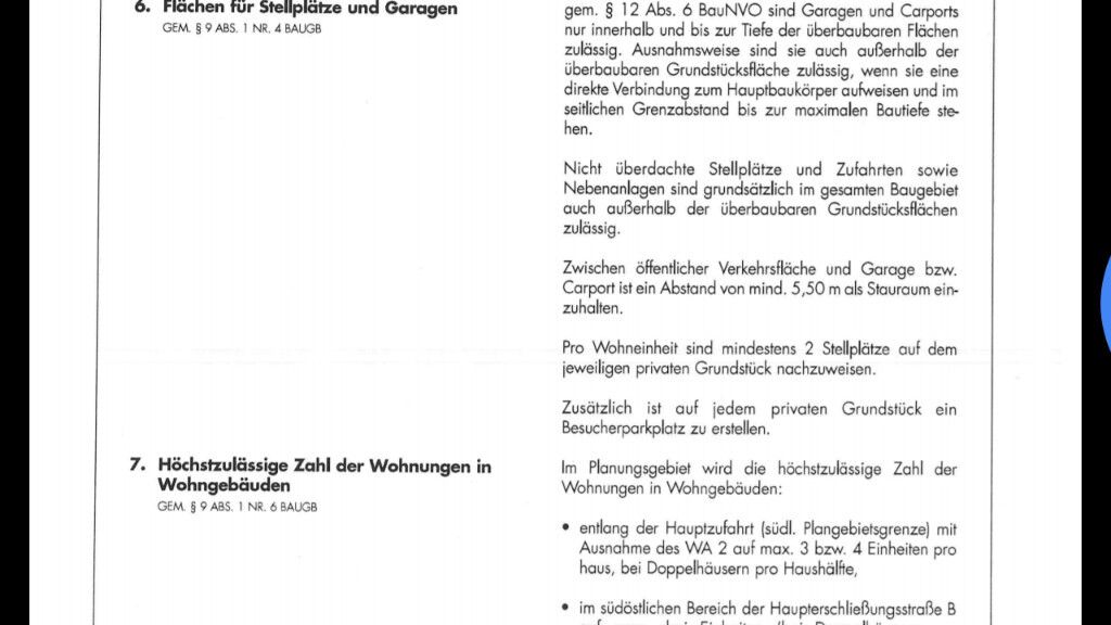 Seite eines Bauplans mit Regeln zu Stellplätzen, Garagen und der Höchstzahl der Wohnungen.