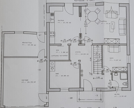 Grundriss eines Einfamilienhauses mit Küche, Wohnzimmer und Eingangsbereich