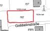 2D-Grundrissskizze eines Hauses mit roter Markierung