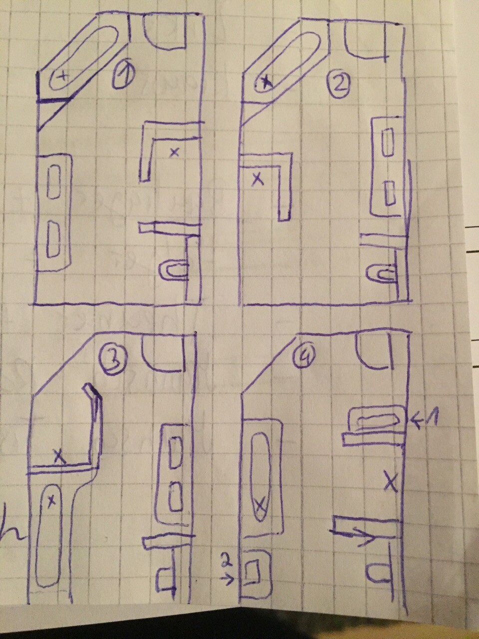 Handgezeichnete Grundriss-Skizzen eines Hauses auf kariertem Papier