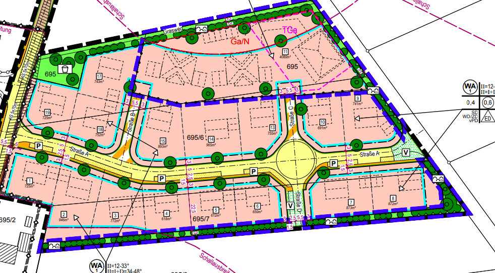 Städtischer Lageplan: Straßen, Rundplatz, Parkplätze, Wohnblöcke, Grünflächen.