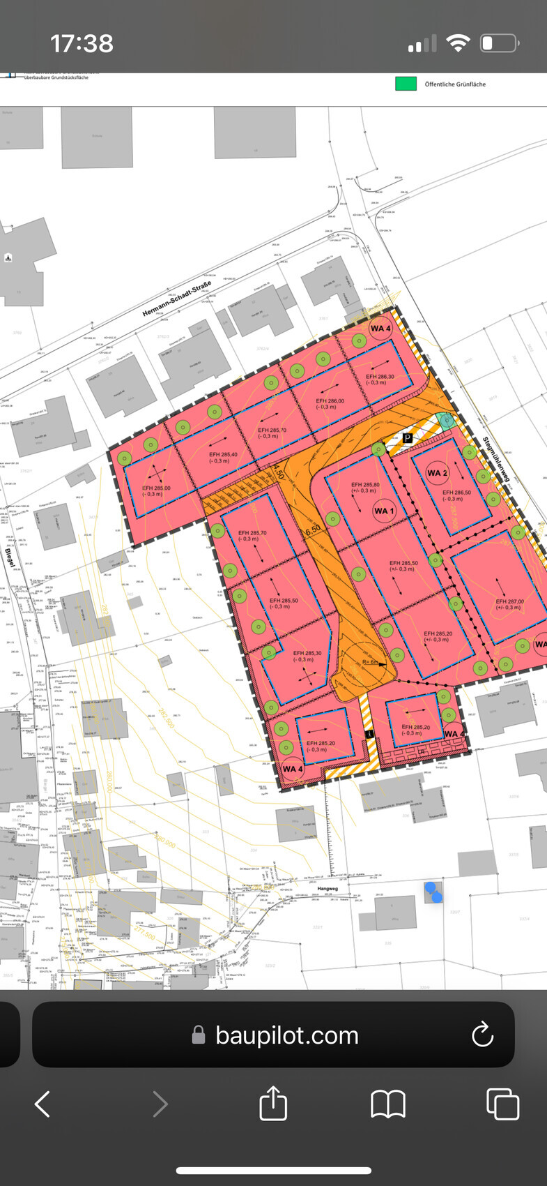Lageplan eines Baugebiets mit farblich gekennzeichneten Bauzonen WA1-WA4, Straßenverlauf und Grünflächen
