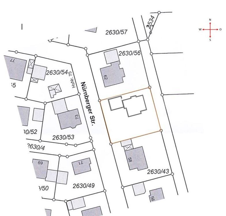 Lageplan eines Grundstücks mit Gebäudeumrissen und Grenzlinien