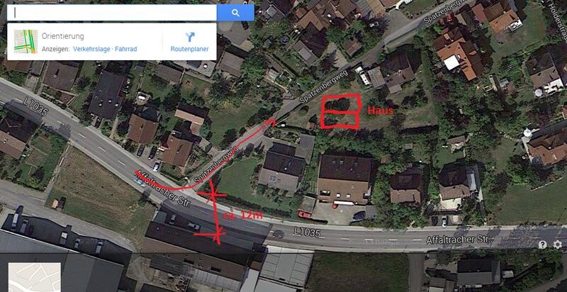 Satellitenansicht eines Wohngebiets mit markiertem Hausgrundstück.
