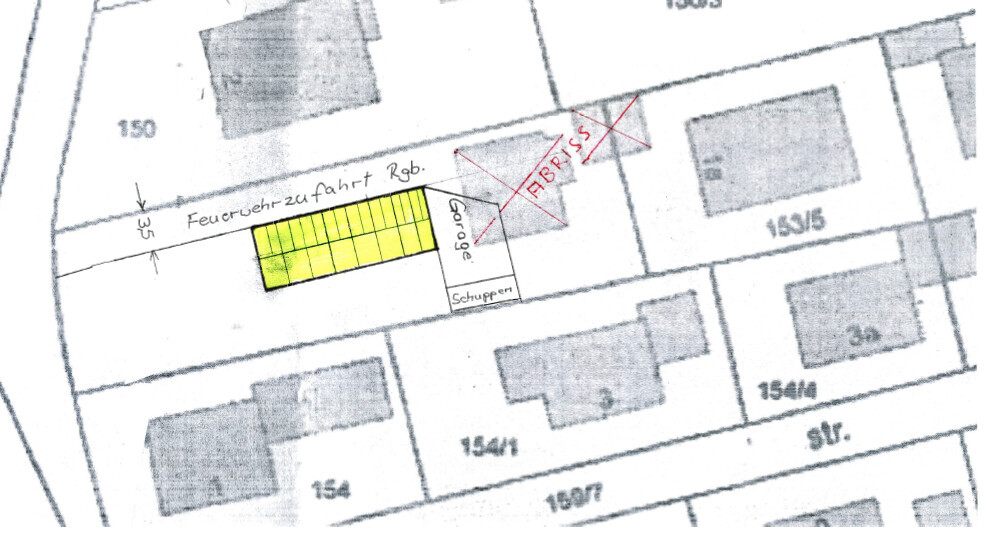 Lageplan eines Grundstücks mit markiertem Baukörper, Zufahrt und Garage