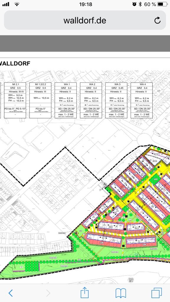 Übersicht des Walldorf-Bebauungsplans mit farbigen Baublöcken, Grünflächen und Straßen.