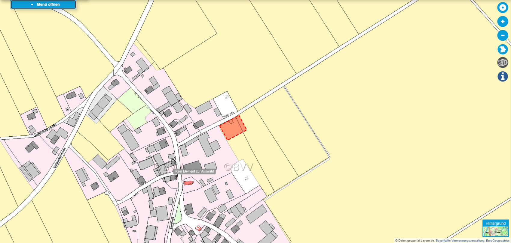 Lageplan mit Grundstücksgrenze und roter Markierung eines Bauplatzes.