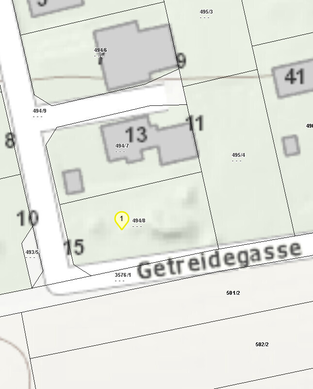 Lageplan mit Grundstücksgrenzen, Parzellen-Nummern und gelbem Marker auf Parzelle 1